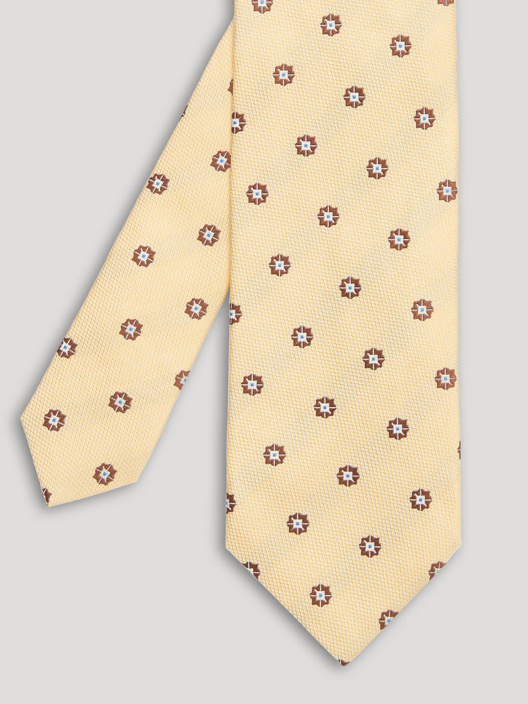 Yellow and brown tie with large pattern
