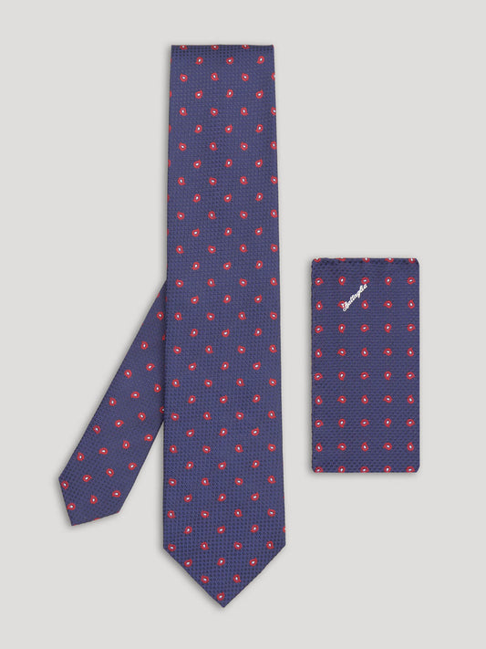 Red and blue tie with large pattern and matching handkerchief