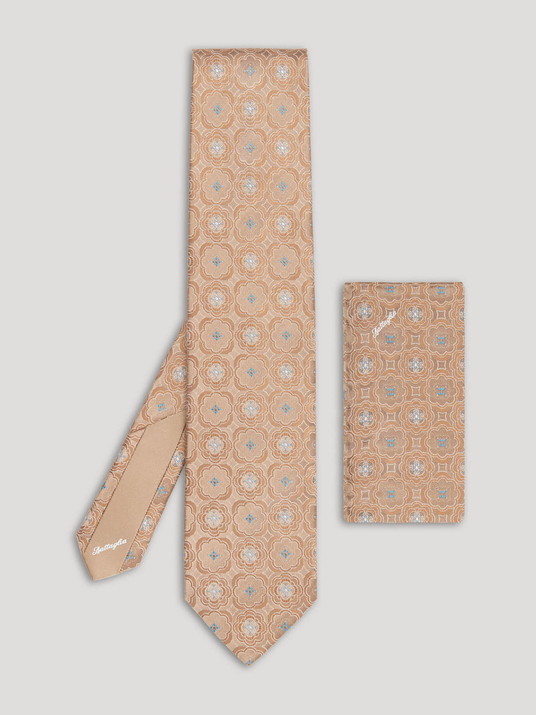 Brown and beige tie with large pattern and matching handkerchief