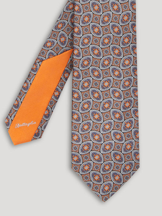 Orange and blue silk tie with large pattern.