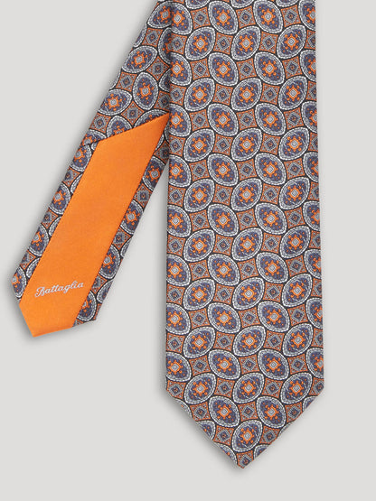 Orange and blue silk tie with large pattern. 