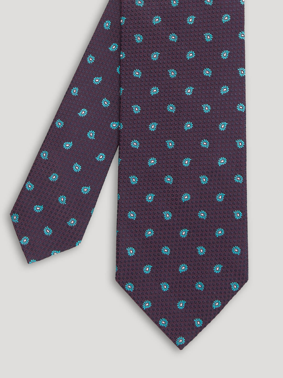 Purple tie with small blue paisley design.