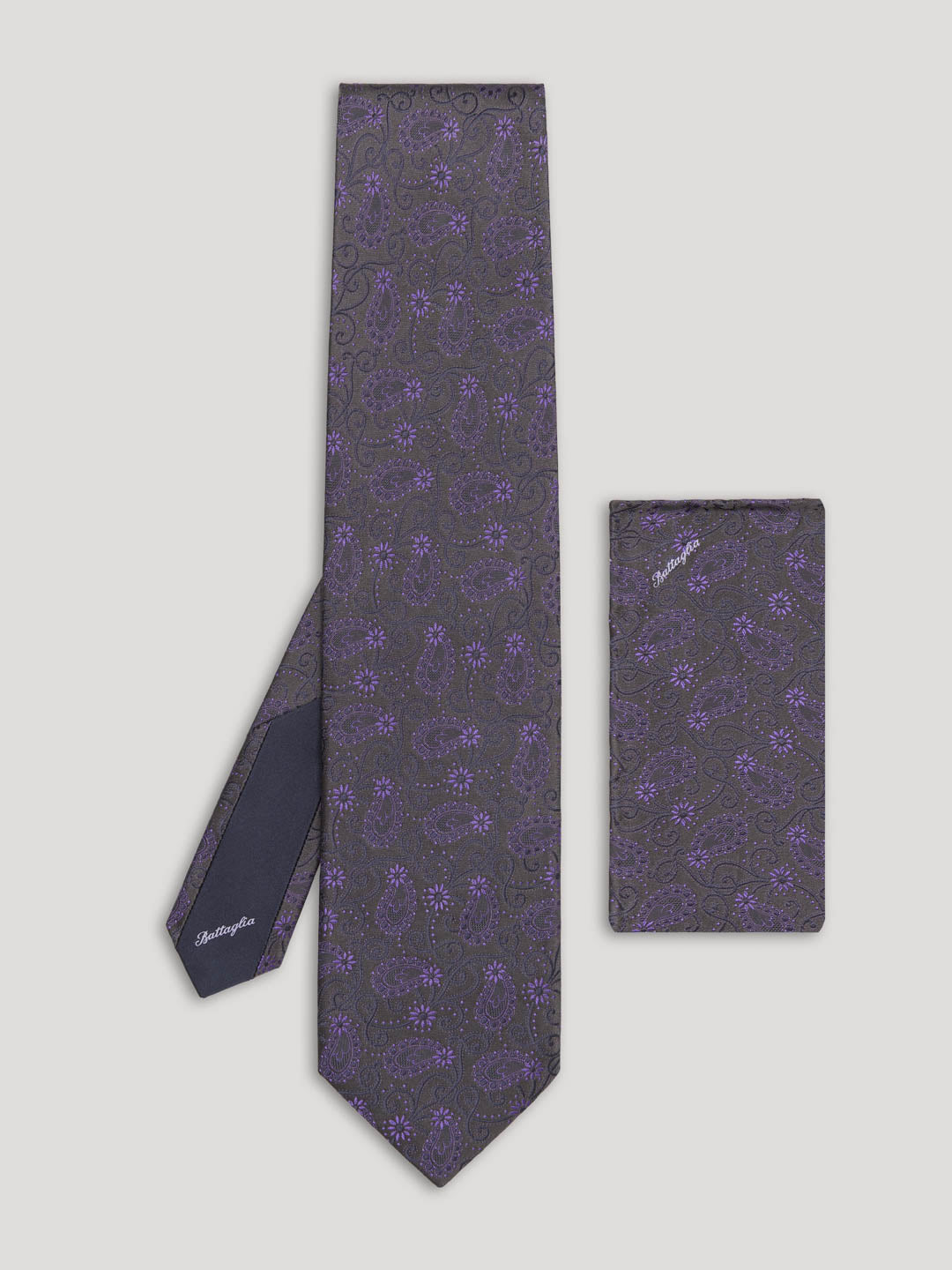Dark purple paisley tie with matching handkerchief.