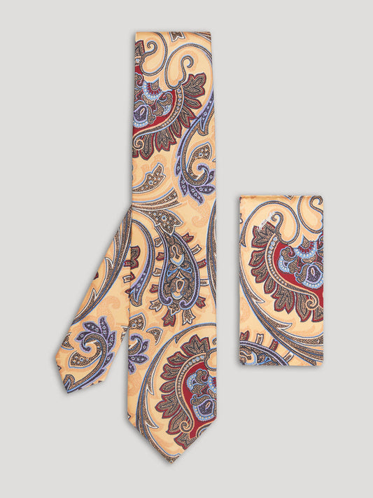 Yellow, red, and blue paisley tie with matching handkerchief. 