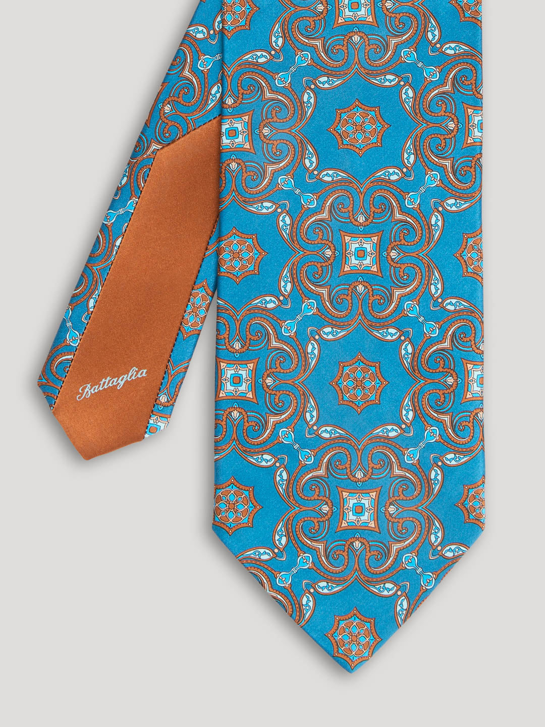 Turquoise and brown paisley tie.