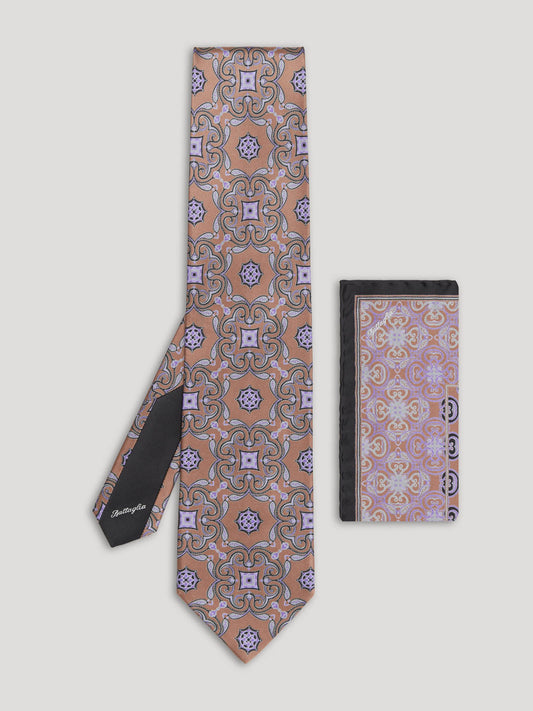 Purple and brown paisley tie with matching handkerchief.