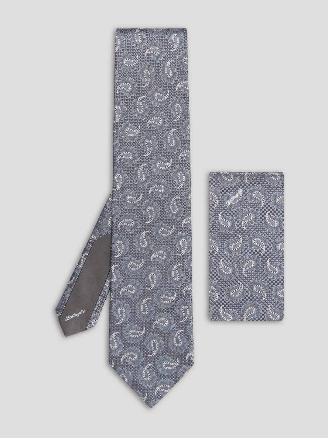 Grey paisley tie with matching handkerchief.
