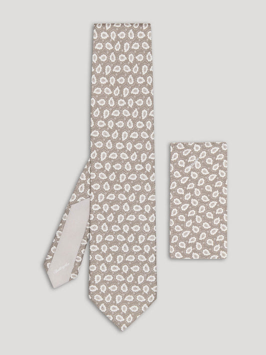 Beige and white paisley tie with matching handkerchief.