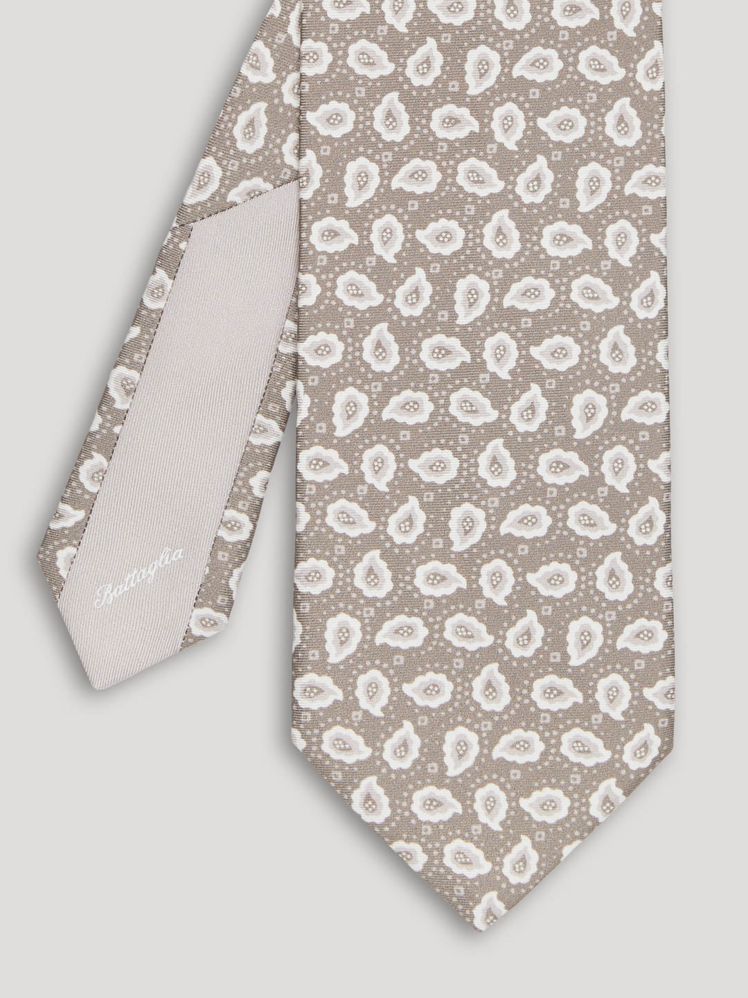 Beige and white paisley tie. 