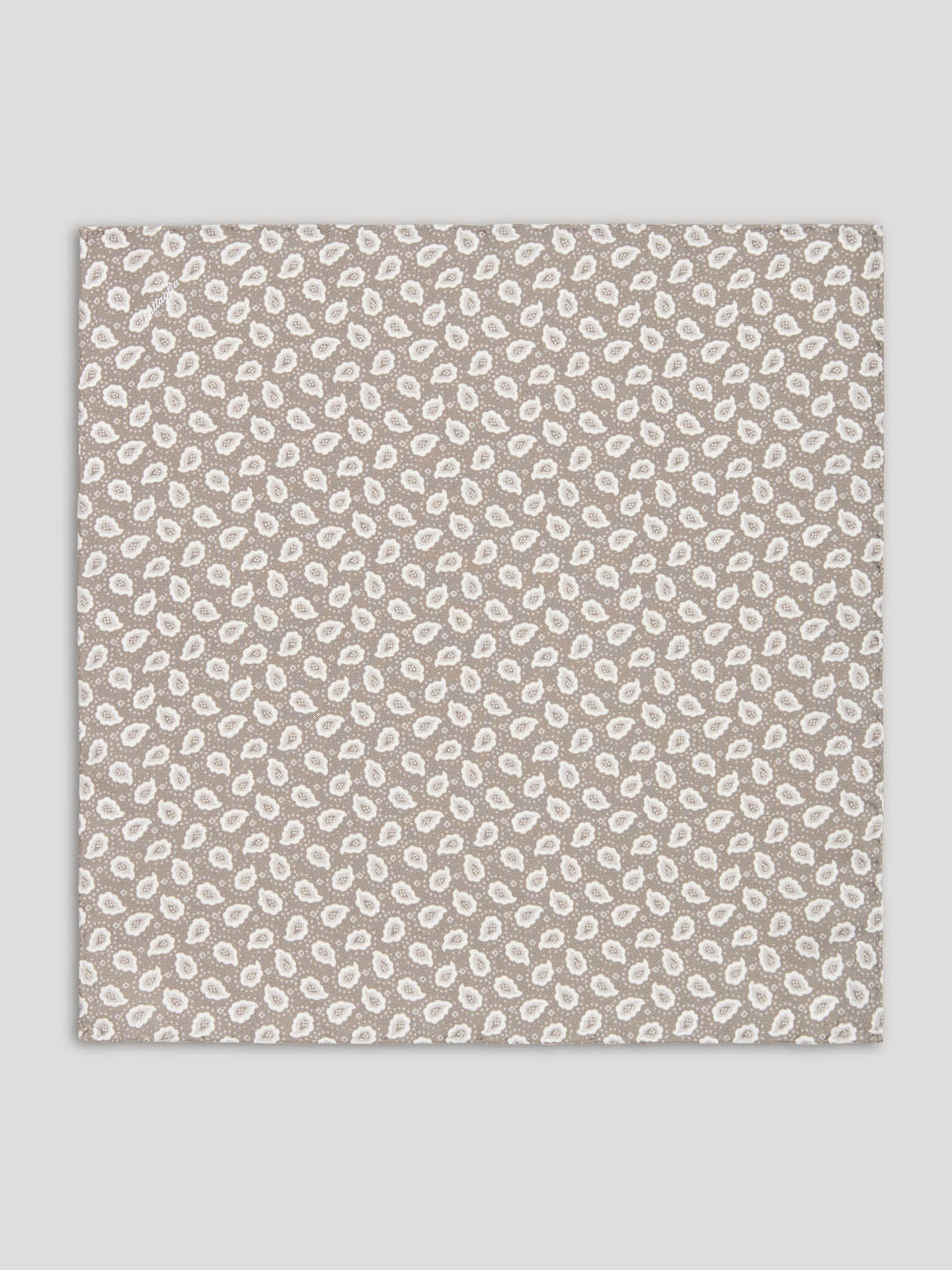 Beige and white paisley handkerchief.