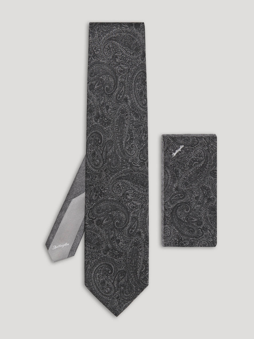 Black paisley tie with matching handkerchief.