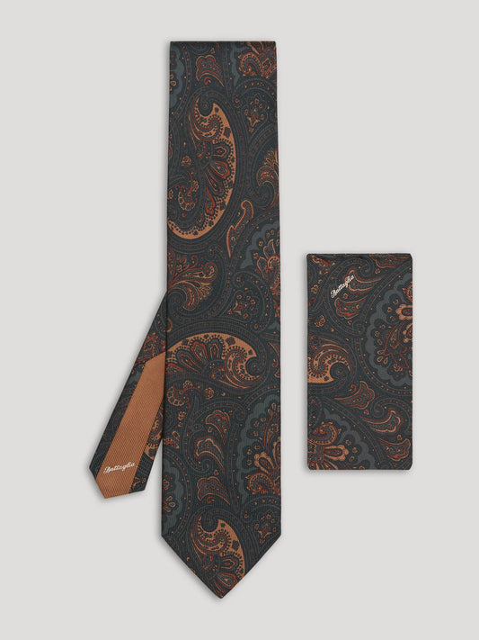 Navy paisley silk tie with matching handkerchief.