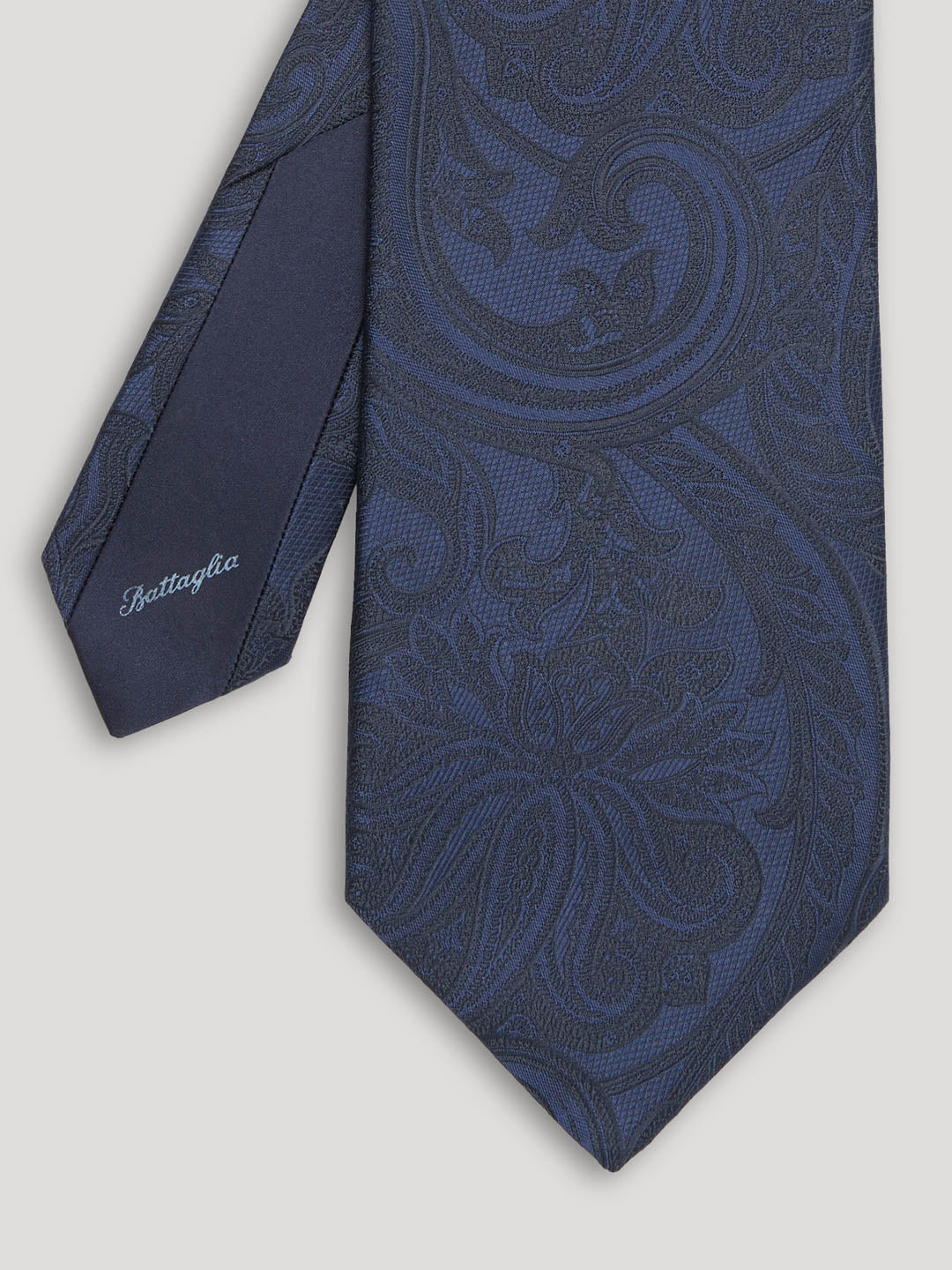 Blue paisley silk tie.