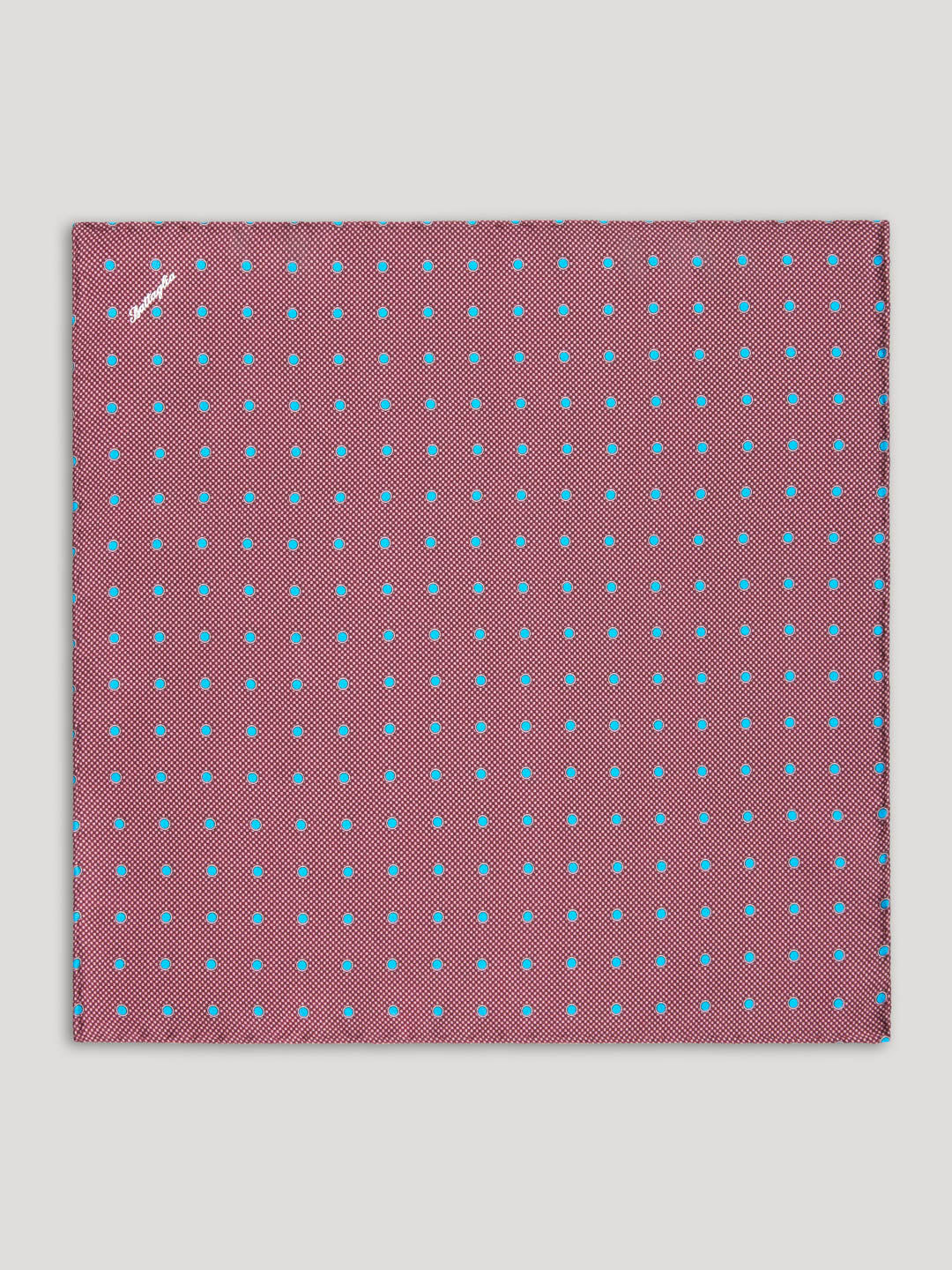 Purple handkerchief with blue polkadots.
