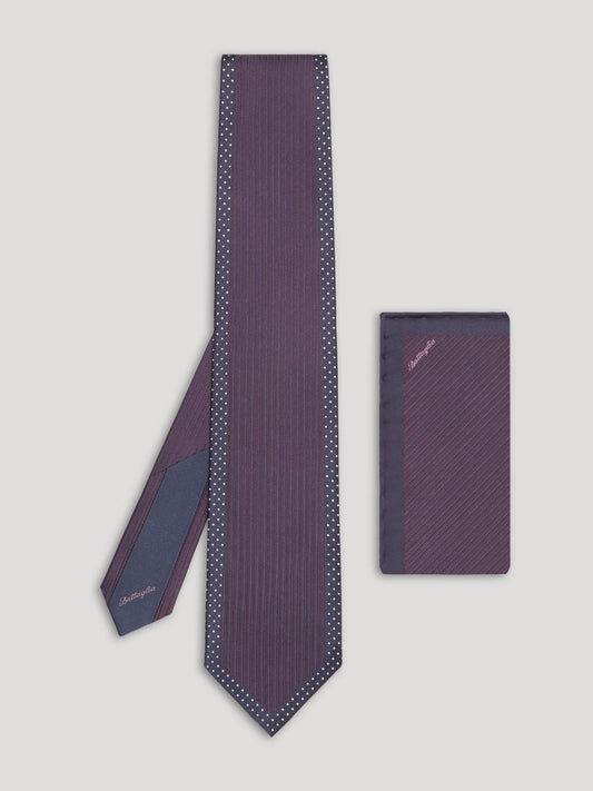 Deep purple tie with small white polkadots and matching handkerchief. 