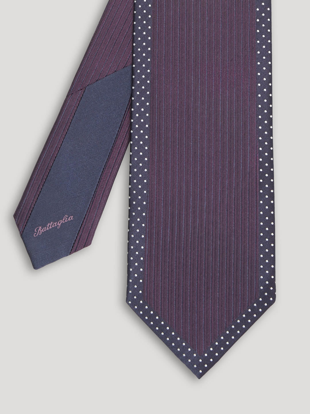Deep purple tie with small white polkadots.  