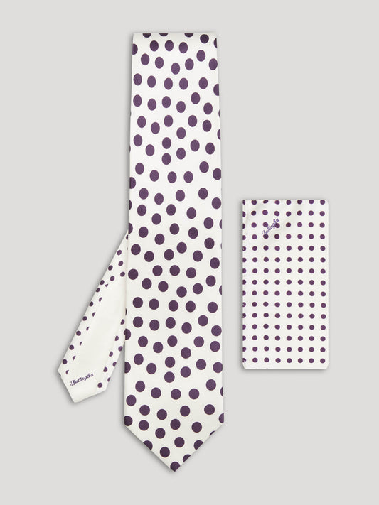 White tie with large purple polkadots and matching handkerchief.