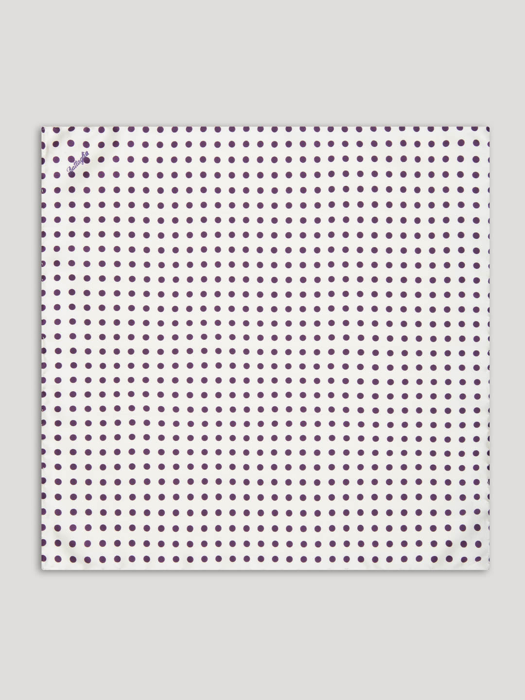White handkerchief with purple polkadots.