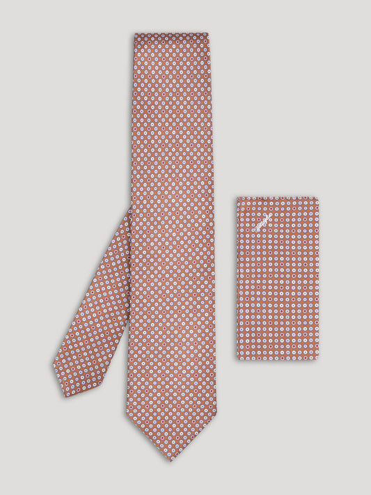 Brown tie with multi colored polkadots and matching handkerchief.
