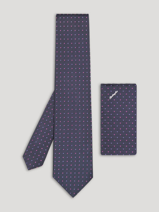 Purple tie with pink and blue polkadots and matching handkerchief.