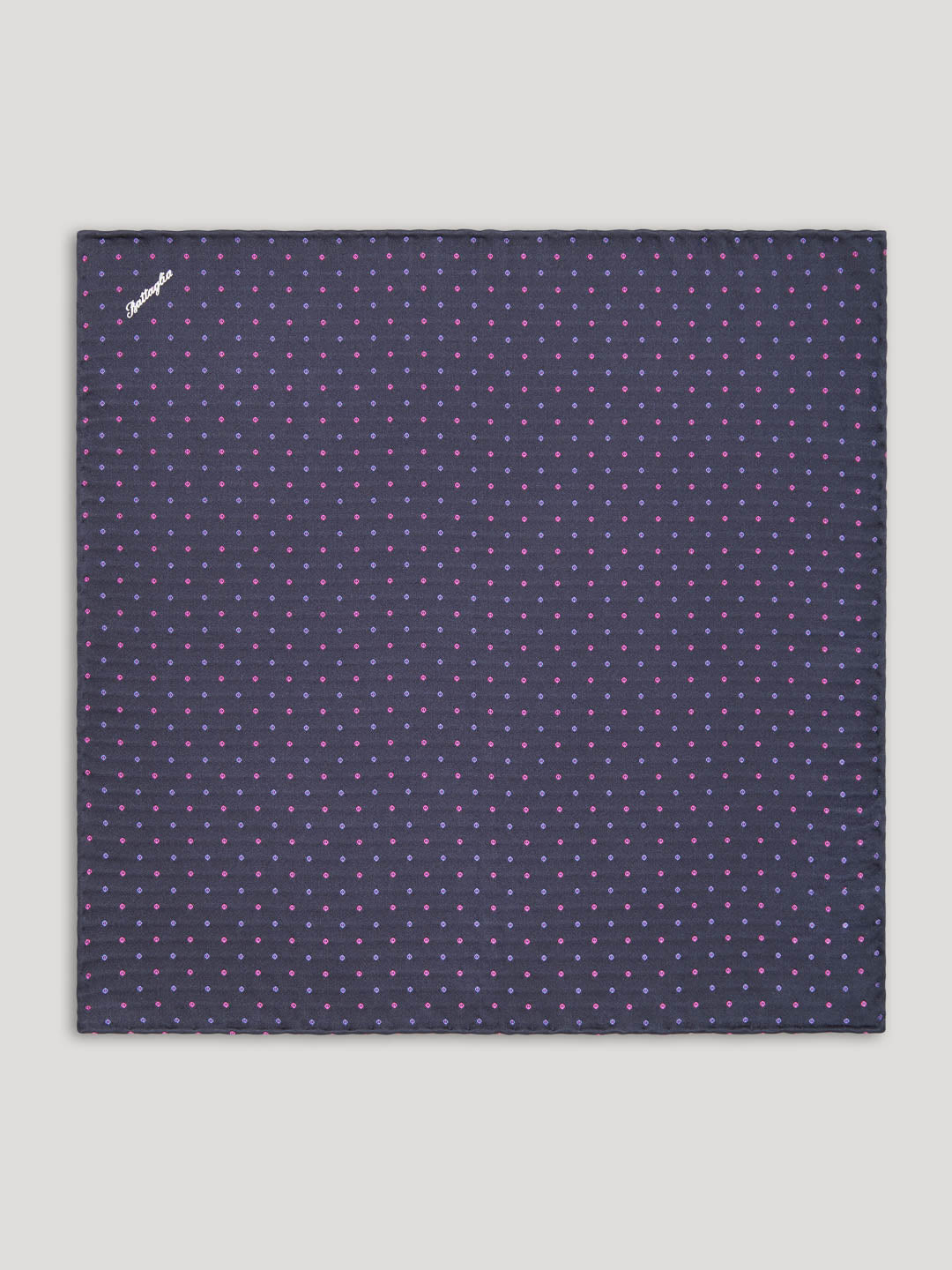 Purple handkerchief with pink and blue polkadots.