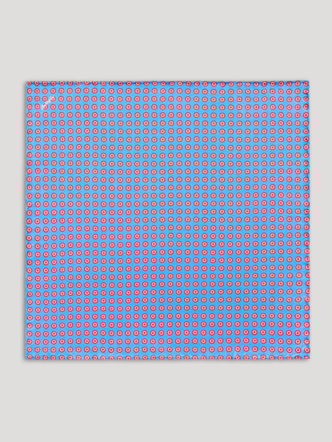 Blue handkerchief with red polkadots.