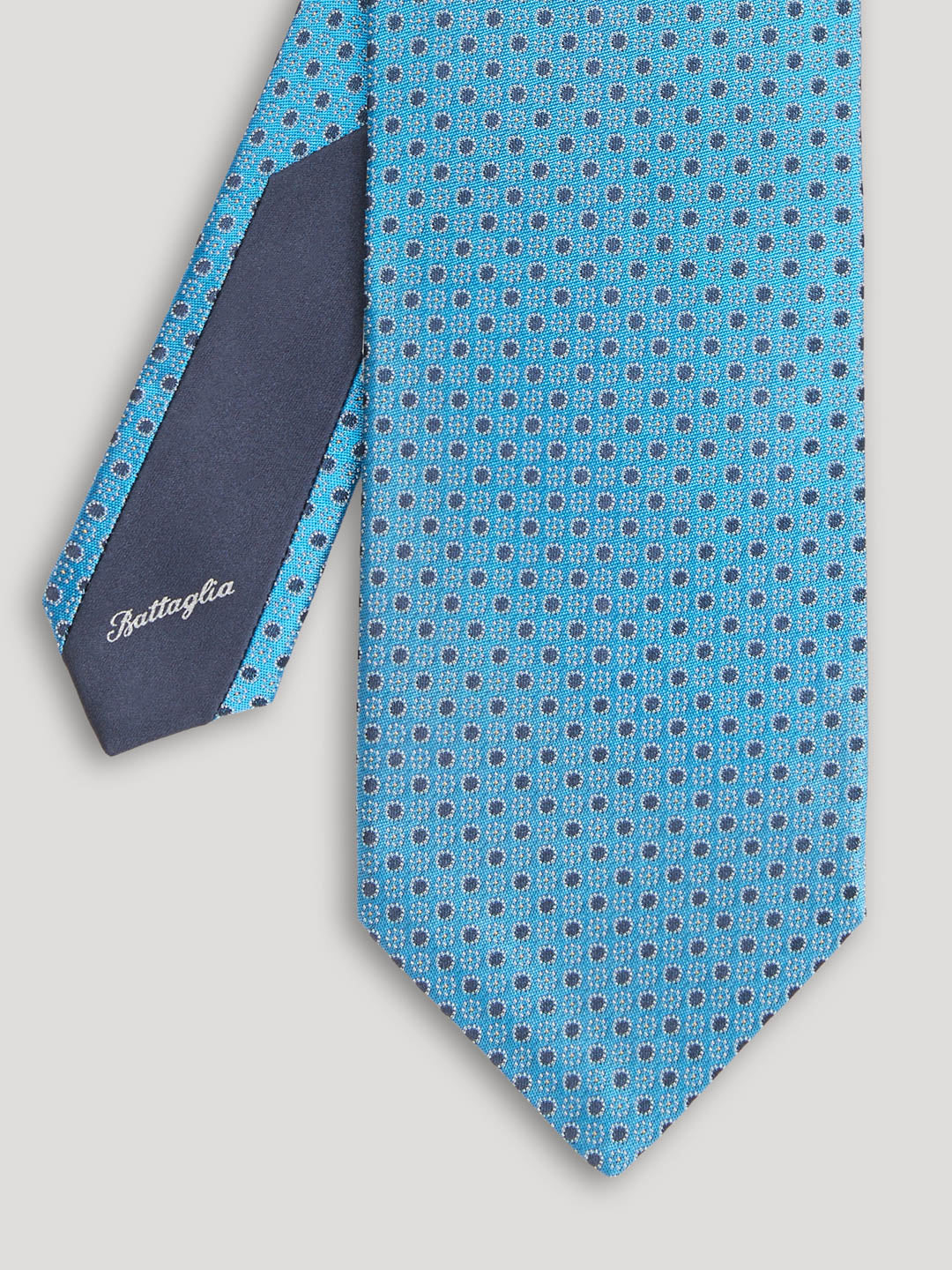 Blue tie with navy polkadots. 