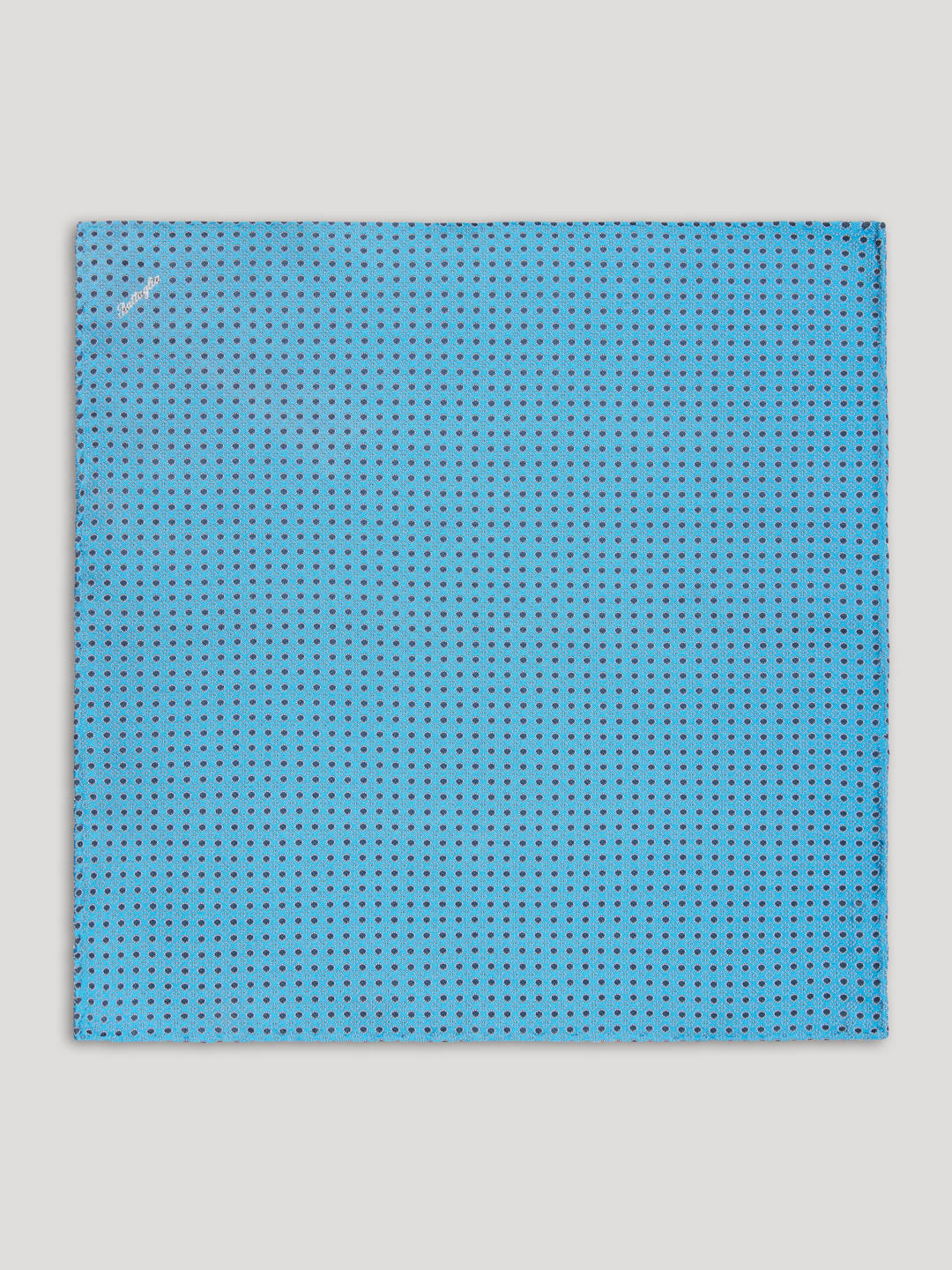 Blue handkerchief with navy polkadots.