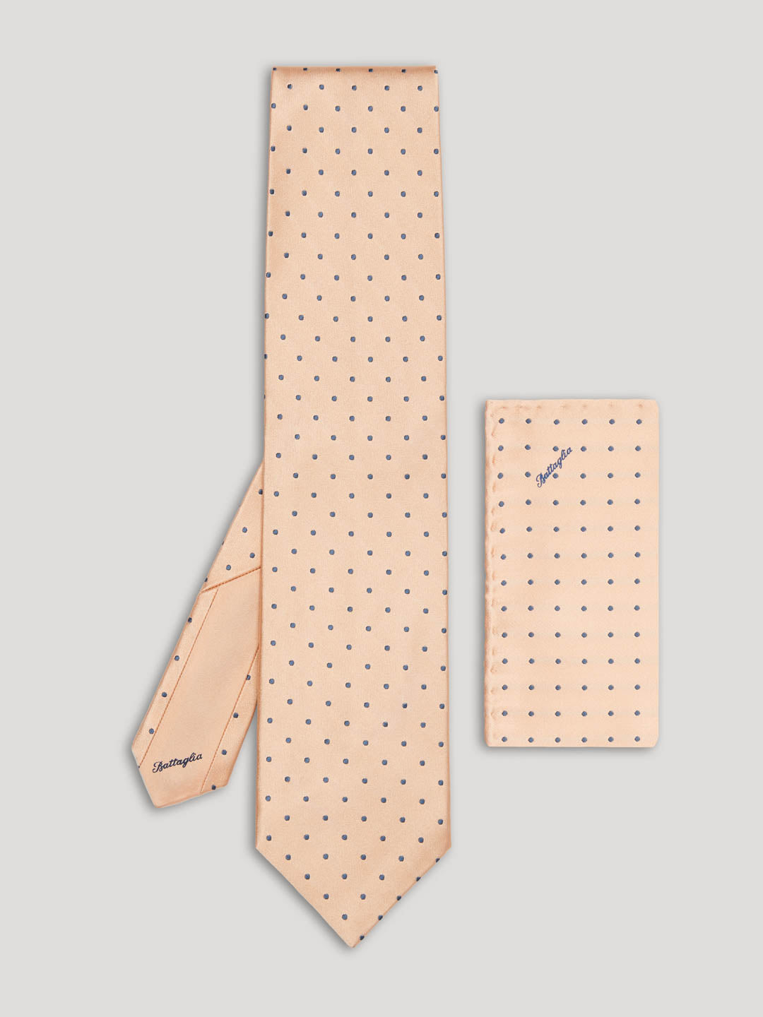 Pink tie with grey polkadots and matching handkerchief.