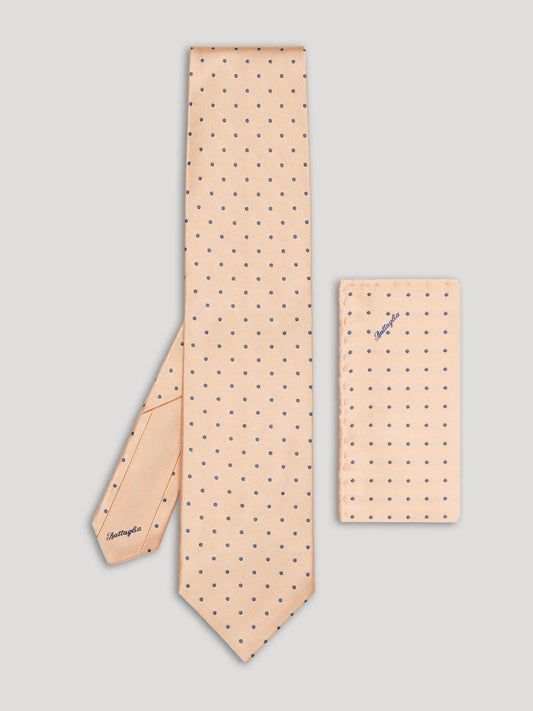 Pink tie with grey polkadots and matching handkerchief.