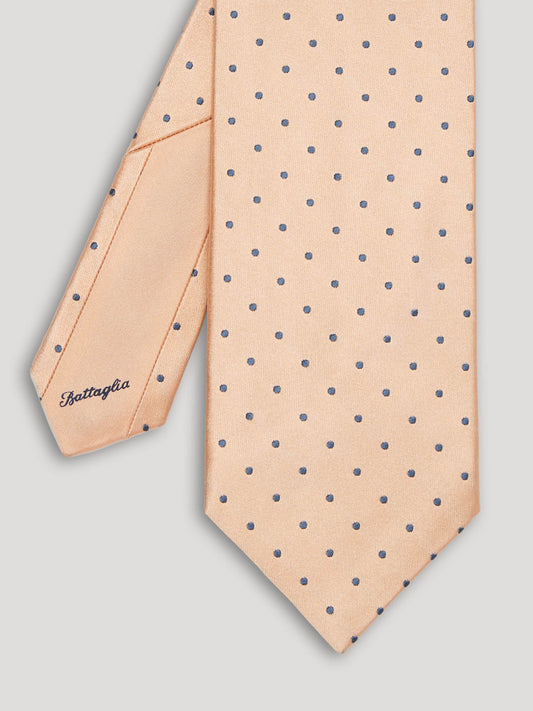 Pink tie with grey polkadots.