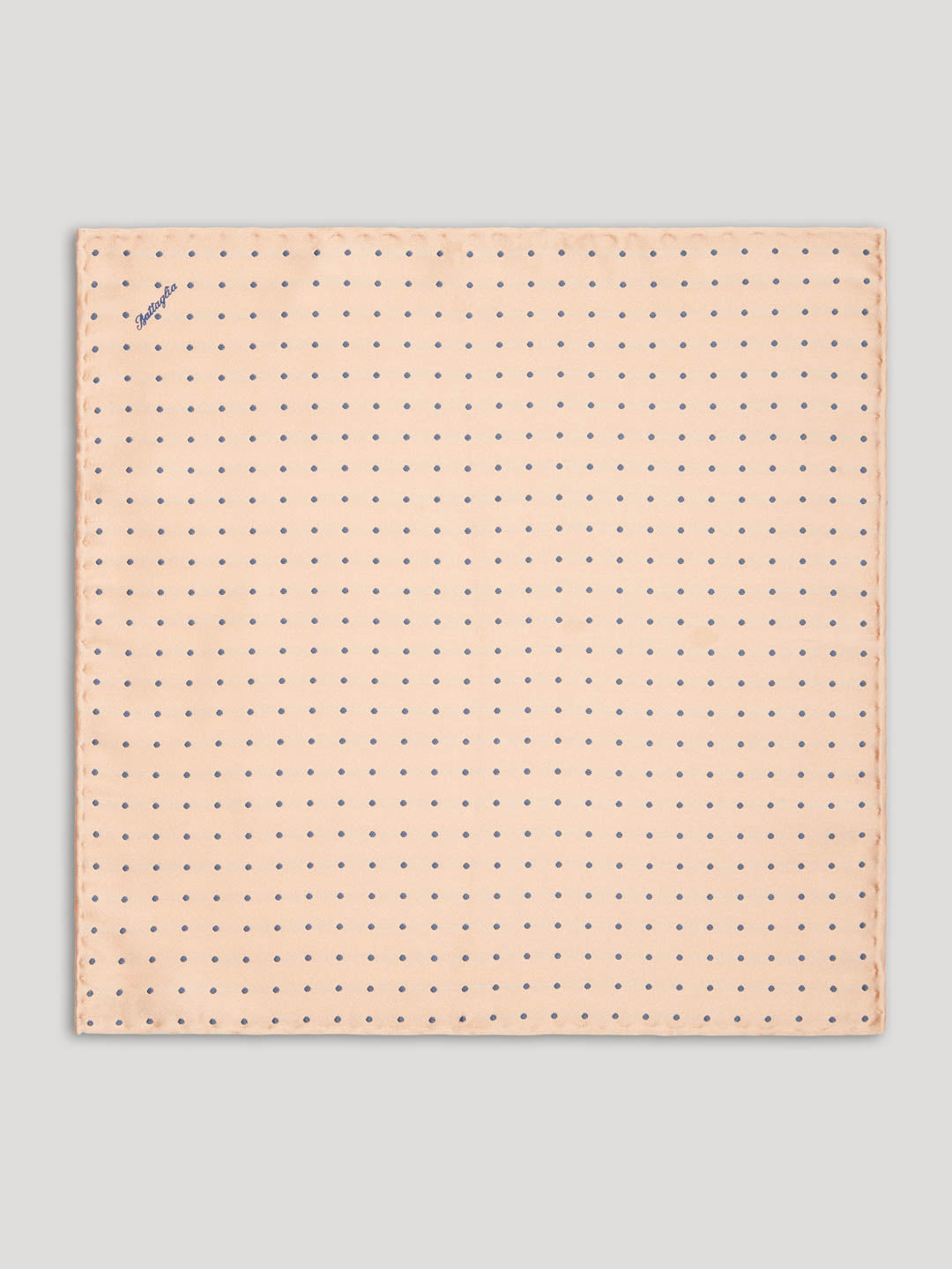 Pink handkerchief with grey polkadots.