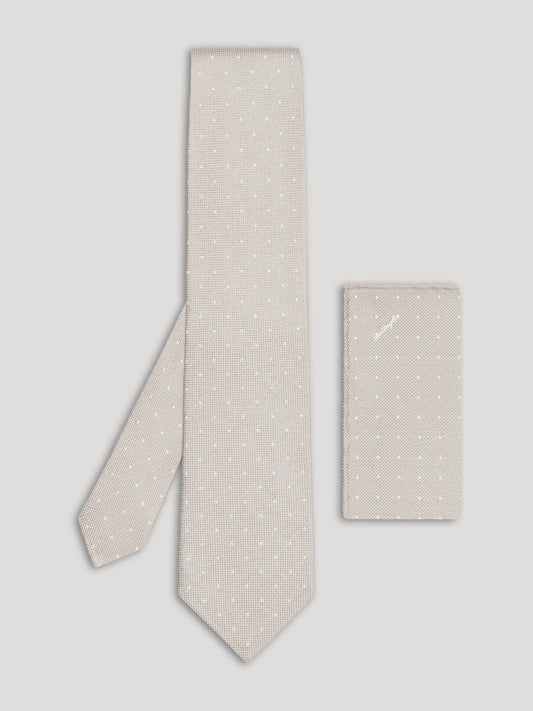 Light grey tie with white polkadots and matching handkerchief.