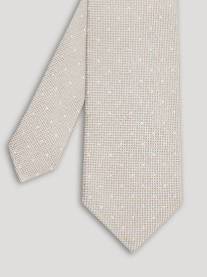 Light grey tie with white polkadots. 