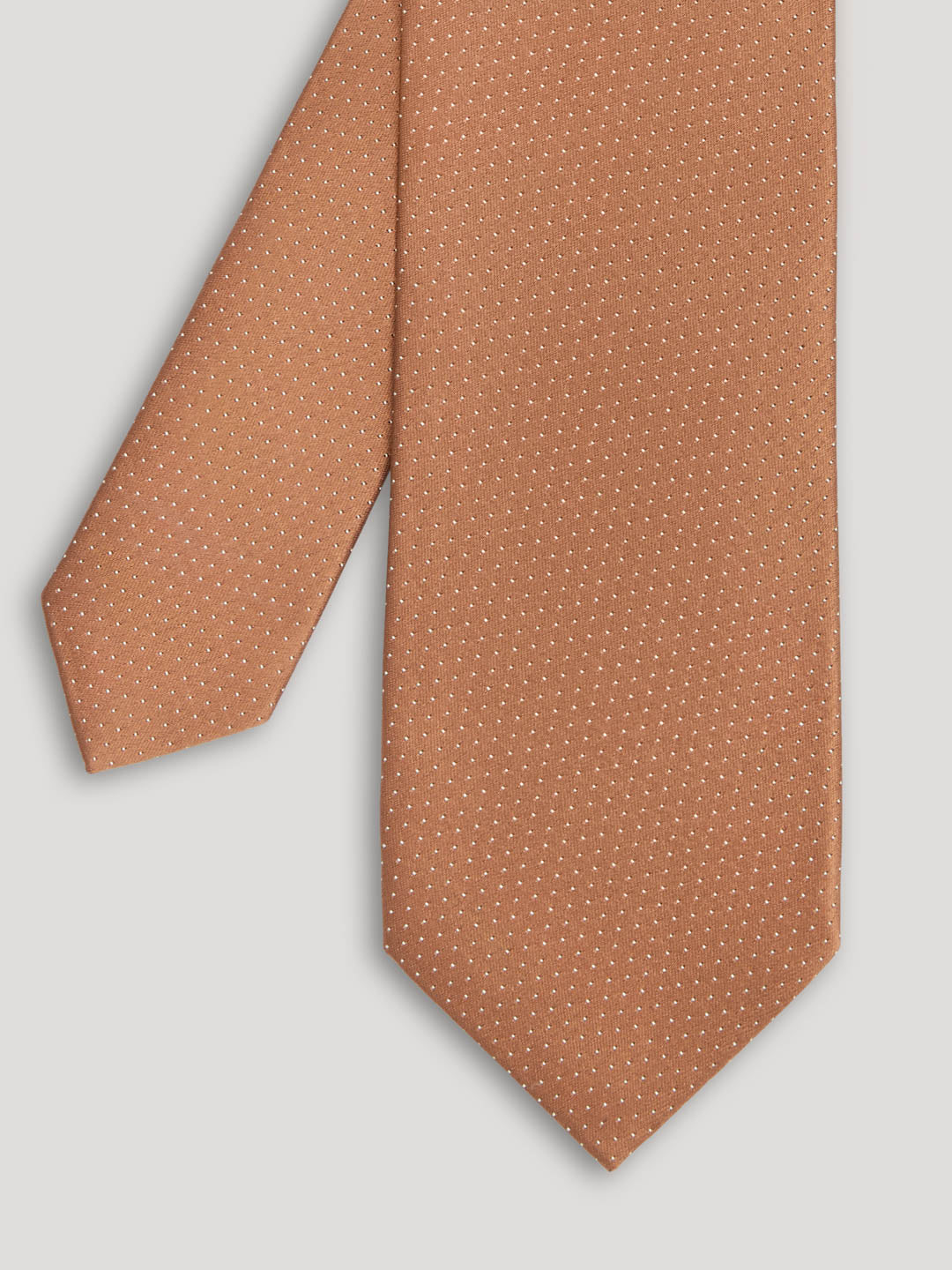Brown tie with small white polkadots.
