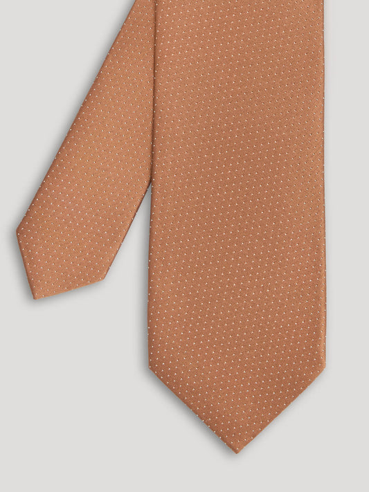 Brown tie with small white polkadots.
