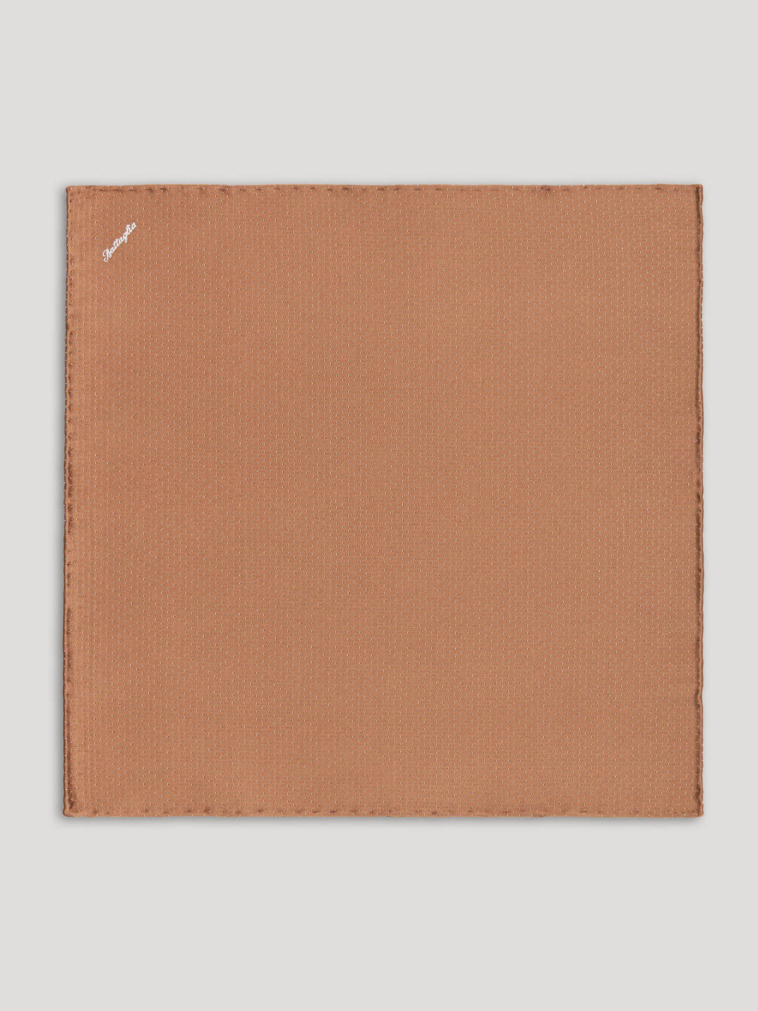 Brown handkerchief with small white polkadots.