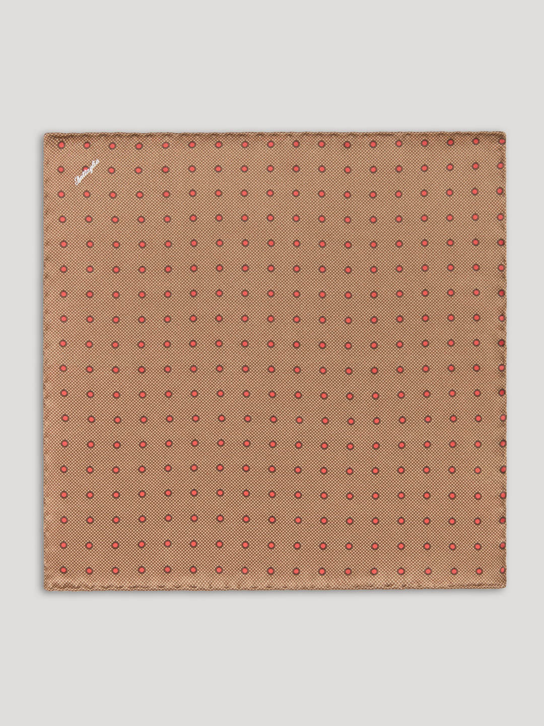 Brown handkerchief with red polkadots.