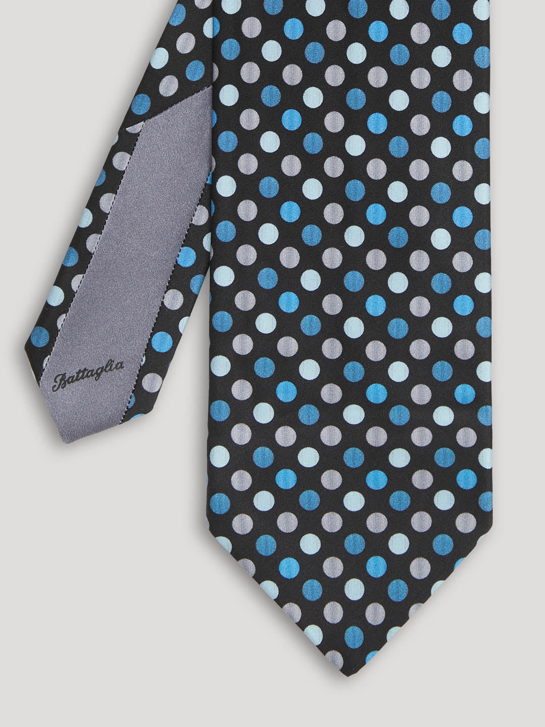 Black tie with blue and gray polkadots. 