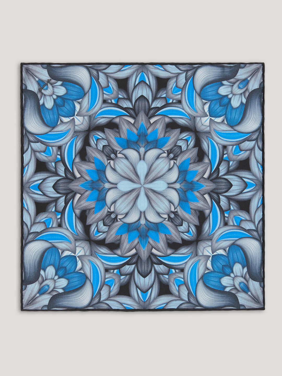 Black, blue, and gray handkerchief with intricate floral design. 