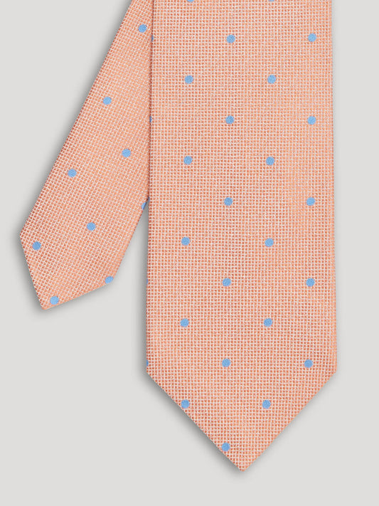 Light orange tie with blue polkadots.