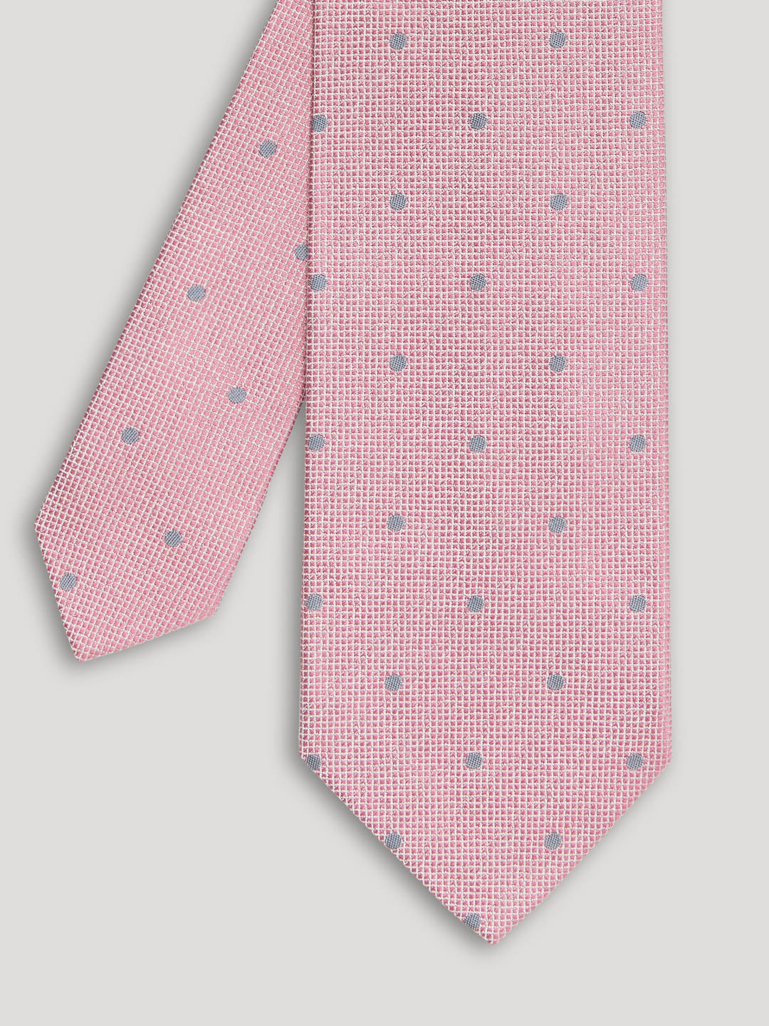 Baby pink tie with grey polkadots.
