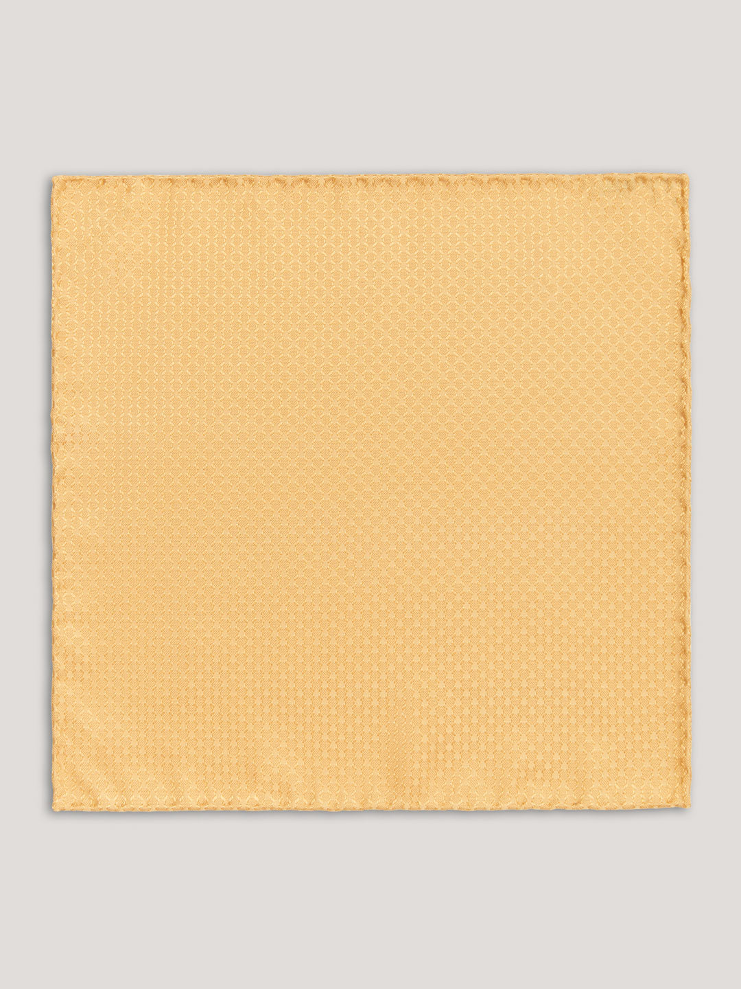Yellow tone on tone handkerchief with small pattern. 