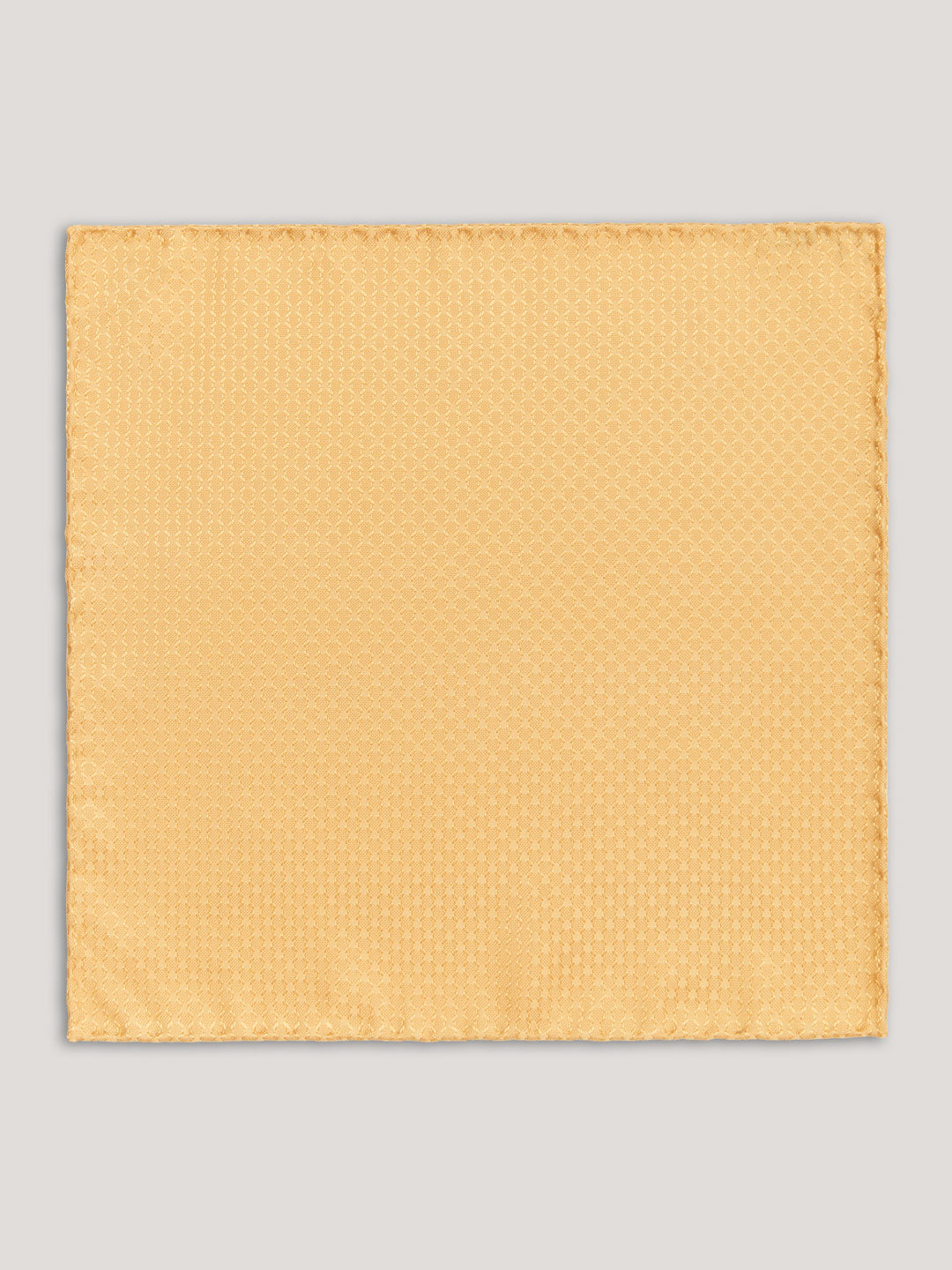 Yellow tone on tone handkerchief with small pattern.