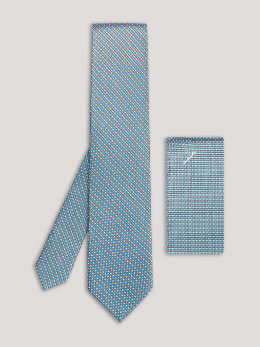 Blue small pattern tie with matching handkerchief.