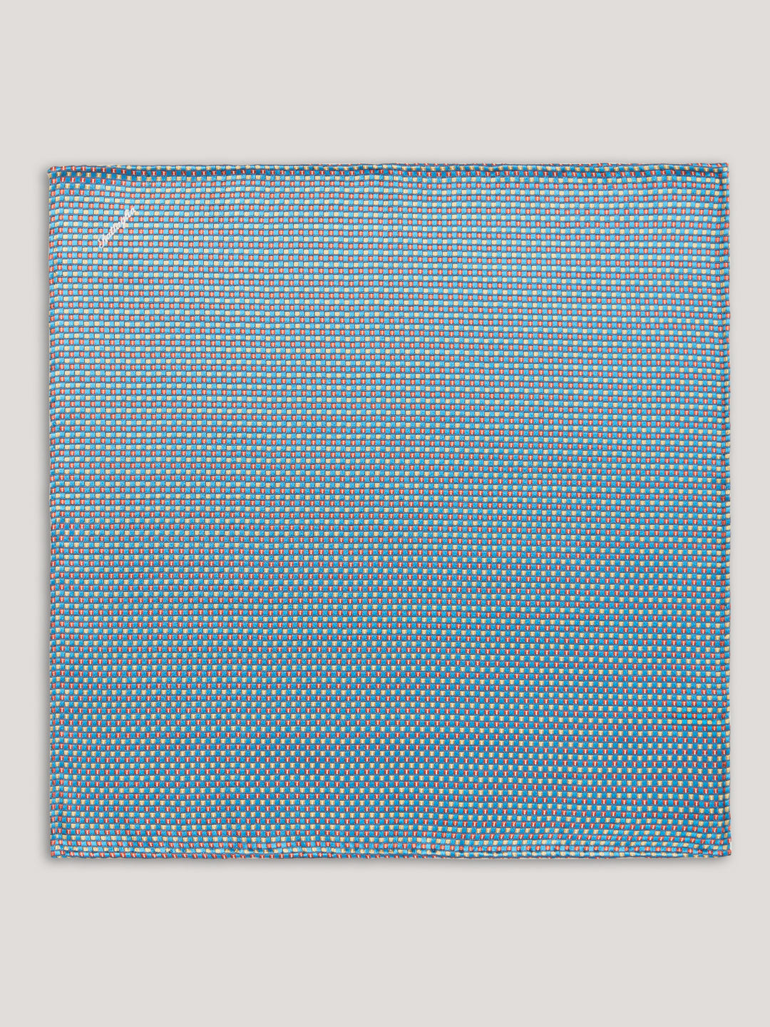Blue handkerchief with small pattern design. 