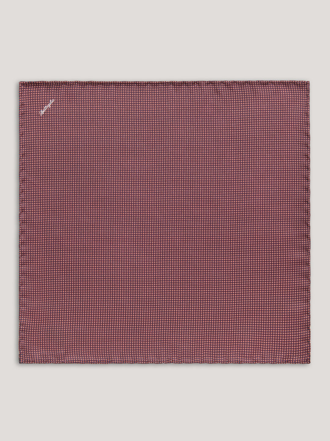 Red handkerchief with small pattern. 