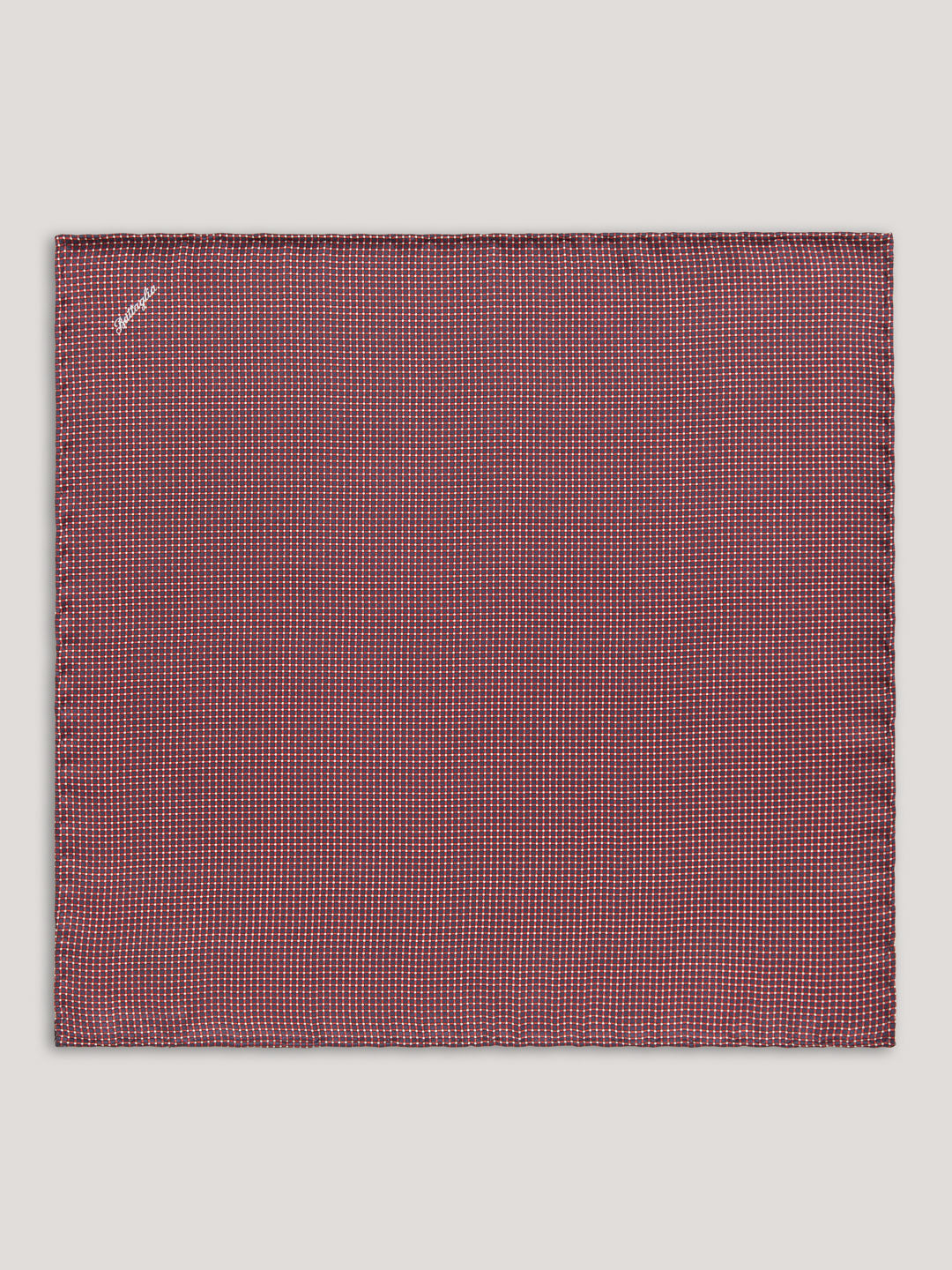 Red handkerchief with small pattern.