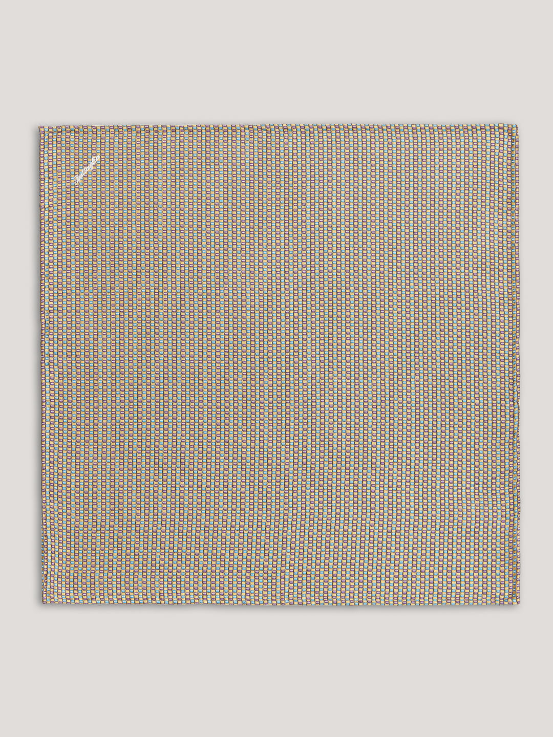Beige handkerchief with small pattern.