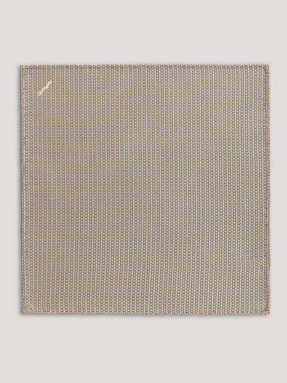 Beige handkerchief with small pattern. 